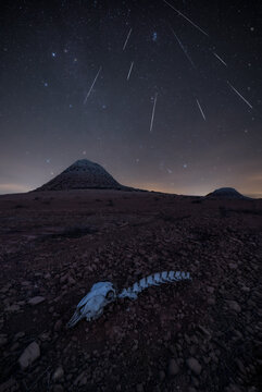 volcano with meteoros and bones