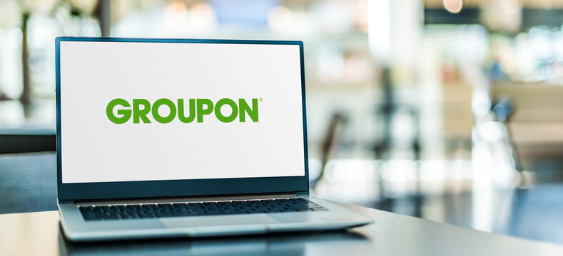 Laptop computer displaying logo of Groupon