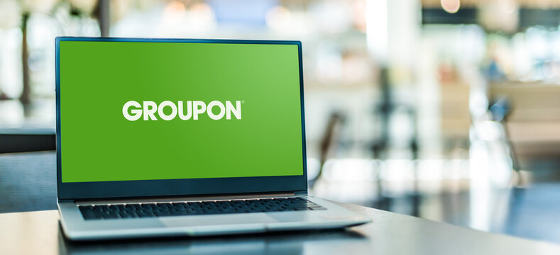 Laptop computer displaying logo of Groupon