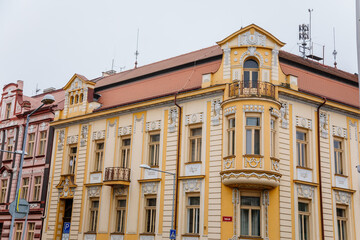 Yellow neo-renaissance house at Wenceslas square in winter day, Narrow picturesque street with...