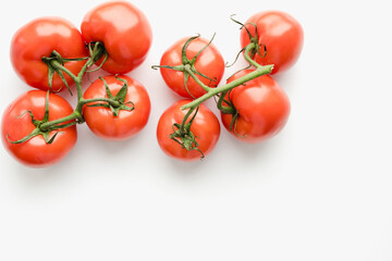 Tomatoes on a white background, tomatoes with a sprig