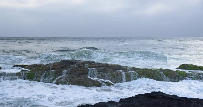 Waves Crashing at Snapper Rocks Gold Coast with Surfer Waiting in the Water