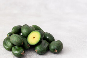 Mini Baby Avocado on grey  background