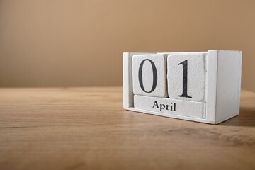 Wooden white small calendar, date 1 April