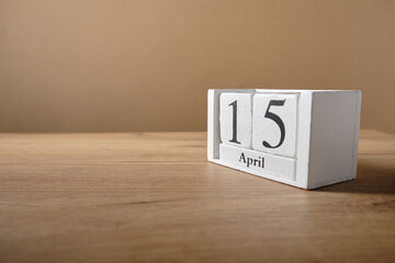 Wooden white small calendar, date 15 April