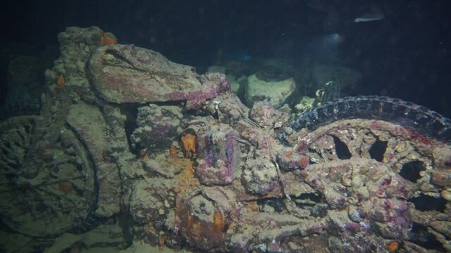An old motorcycle in the hold of a sunken ship. Frozen history under water. Thistlegorm is the best wreck on the Red Sea.