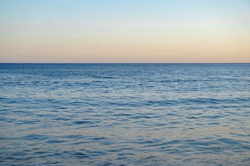 The beautiful colourful Atlantic Ocean at sunset on the South Coast of Cornwall