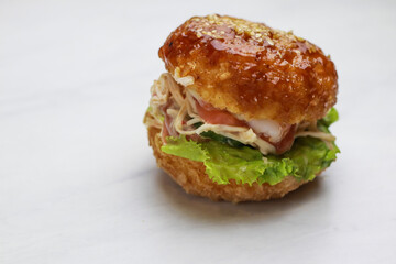 Tasty sushi burger on light background