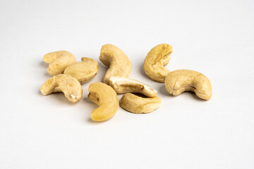 Fototapeta na wymiar Raw cashew nut group without salt on neutral background close up detail