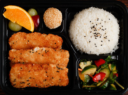 Chines Food Box With Fried Fish And Rice