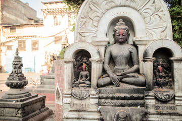 Buddha statue nepalese style at Swayambhunath pagoda or Swayambu chedi or Swoyambhu stupa or Monkey Temple for nepali people and foreign travelers travel visit respect praying god in Kathmandu, Nepal