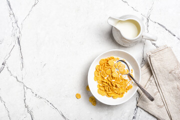 Tasty breakfast of sweet cornflakes with milk