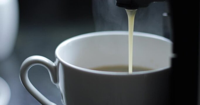 pouring coffee into a cup