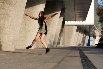 Fototapeta na wymiar young attractive woman in short dress running