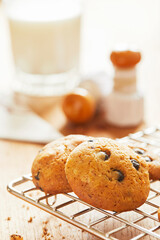 Choco cookies with making products on table.
