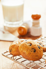 Choco cookies with making products on table.