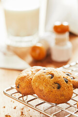 Choco cookies with making products on table.