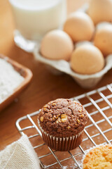 Muffin with making products on table.