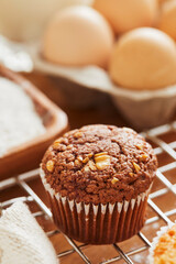 Muffin with making products on table.