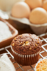 Muffin with making products on table.