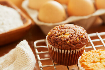 Muffin with making products on table.