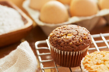 Muffin with making products on table.