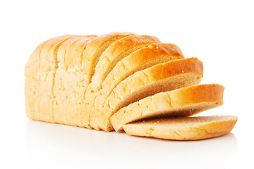 The cut loaf of white bread with reflection on white