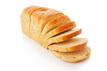 The cut loaf of white bread with reflection on white