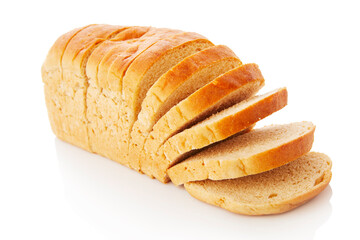 The cut loaf of white bread with reflection on white