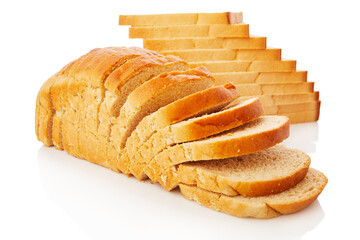The cut loaf of white bread with reflection on white