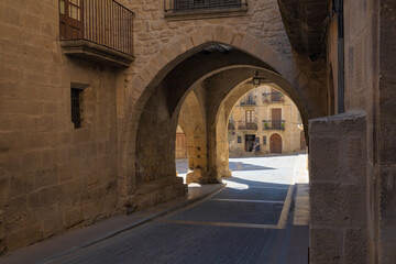Fototapeta premium Entrance to the arcaded square of the historic center of Calaceite, Teruel, Spain