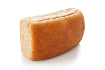long loaf of whole wheat bread on white background.