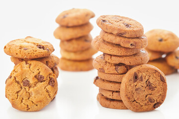 Stack of Chocolate chip cookies on white.