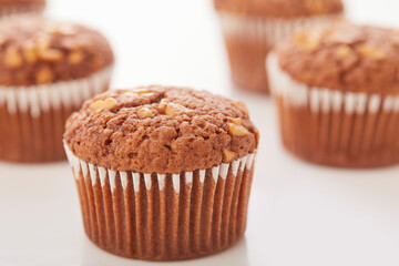 Stack of muffins on white background.