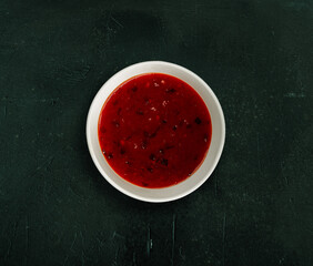 Hot, spice kethcup in a white bowl