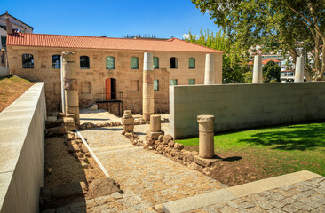 View of the facade and exterior of the building of the Roman spa or D. Afonso Henriques spa in S&atilde;o Pedro do Sul, Portugal, on a summer afternoon.