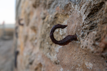 old rusty hook on the wall