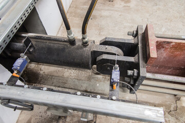 fragment of the hydraulic actuator for moving the biomass from the storage