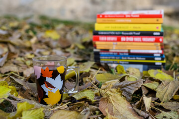 Naklejka na ściany i meble Autumn scene. Coffee cup and books