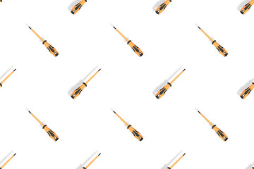 Screwdrivers seamless pattern. Metal screwdrivers with a rubberized handle on a white background.