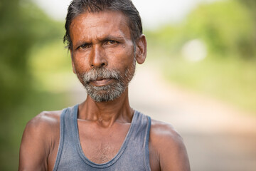 Middle age village man on nature outdoor background.