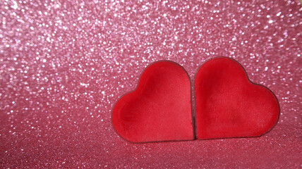 two red hearts on a pink background. copy space. banner