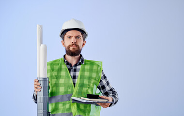 Builder in white helmets construction engineer blueprints work professional blue background