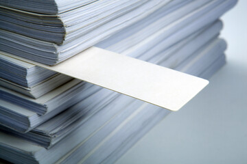 stack of white paper documentation and the bookmark