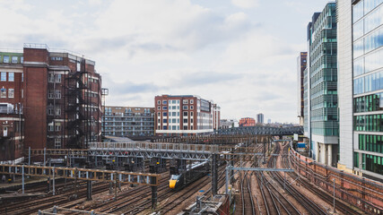 Fototapeta premium Train tracks near Paddington train station and buildings in London, UK