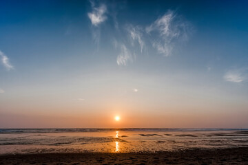Sunset on beach of Atlantic Ocean
