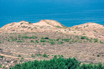 Sand dunes in front of Atlantic Ocean