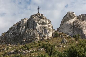 Fototapeta premium The cross on the background of clear sky at the top Biaklo (or Maly Giewont) near Olsztyn near Czestochowa