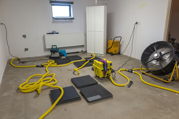 Drying a concrete floor under a fabric covering. After pouring, initial drying, and then drilling...