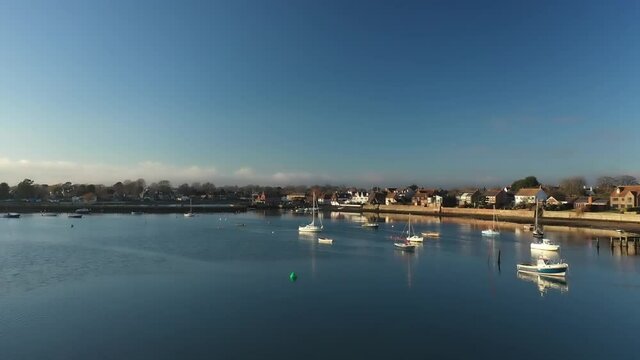 Yachts and Boats aerial footage on the serene estuary at Emsworth in Southern England.